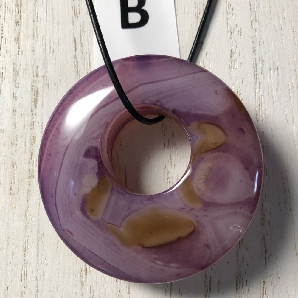 Fluorite necklaces on a leather cord.